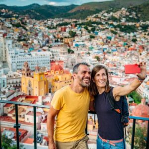 Couple taking a selfie with Guanajuato City panoramic view