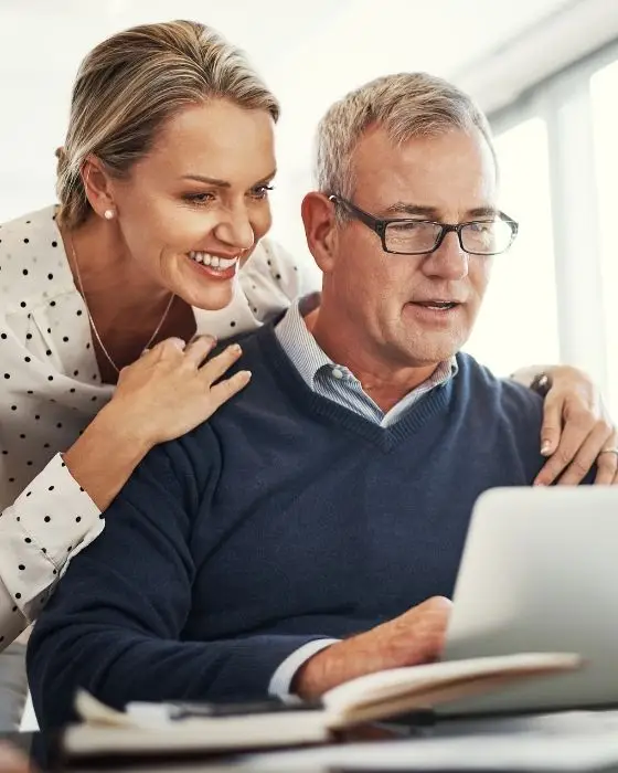 An early retired couple reviewing their medical insurance proposed plans.