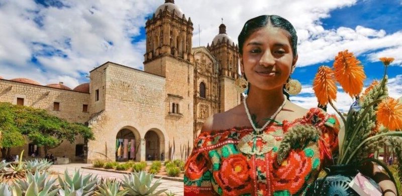 Native Mexican Female, holding flowers in front of the Santo Domingo Church in Oaxaca Mexico.
